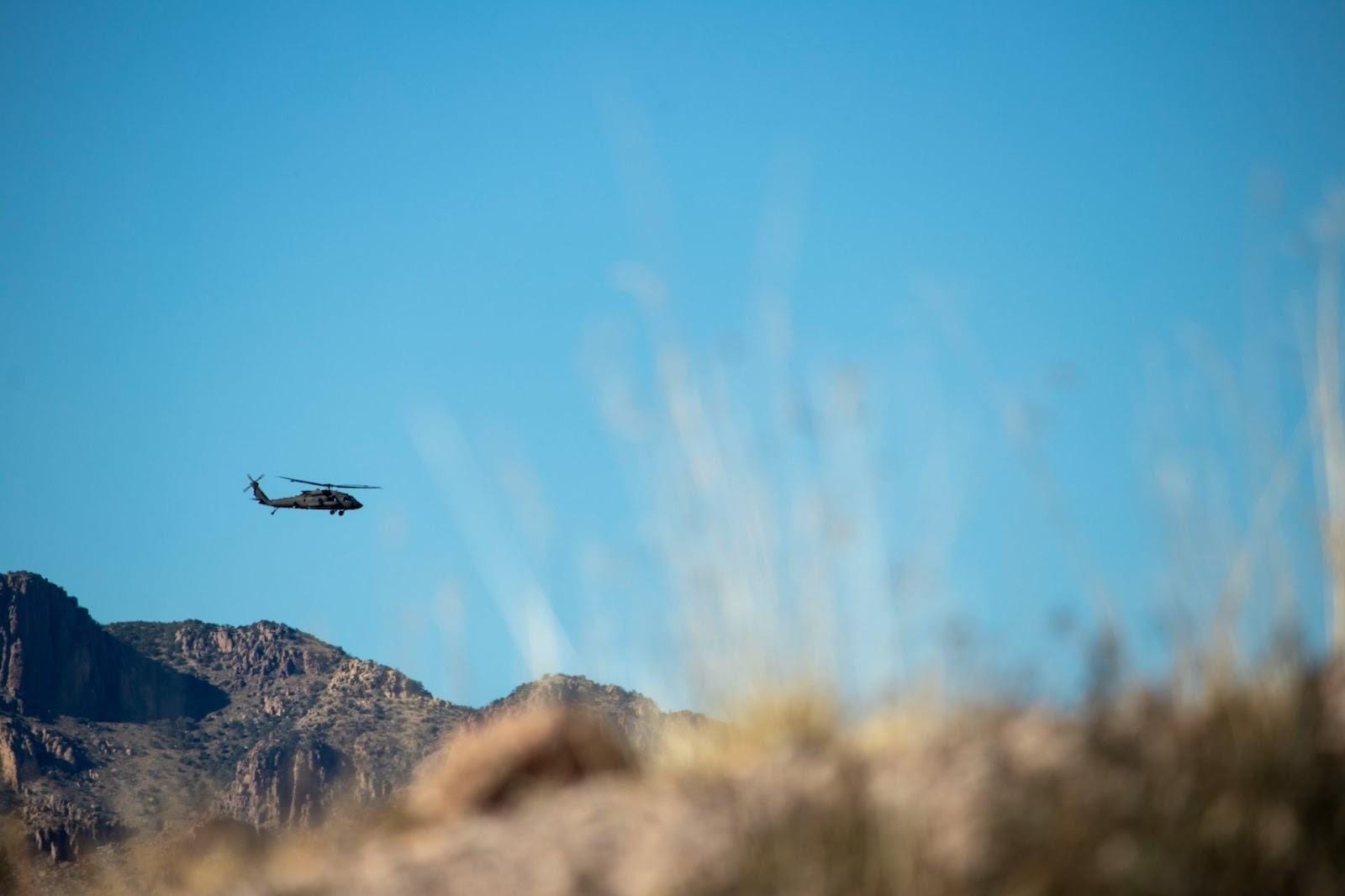 A helicopter flying over a mountain
AI-generated content may be incorrect.