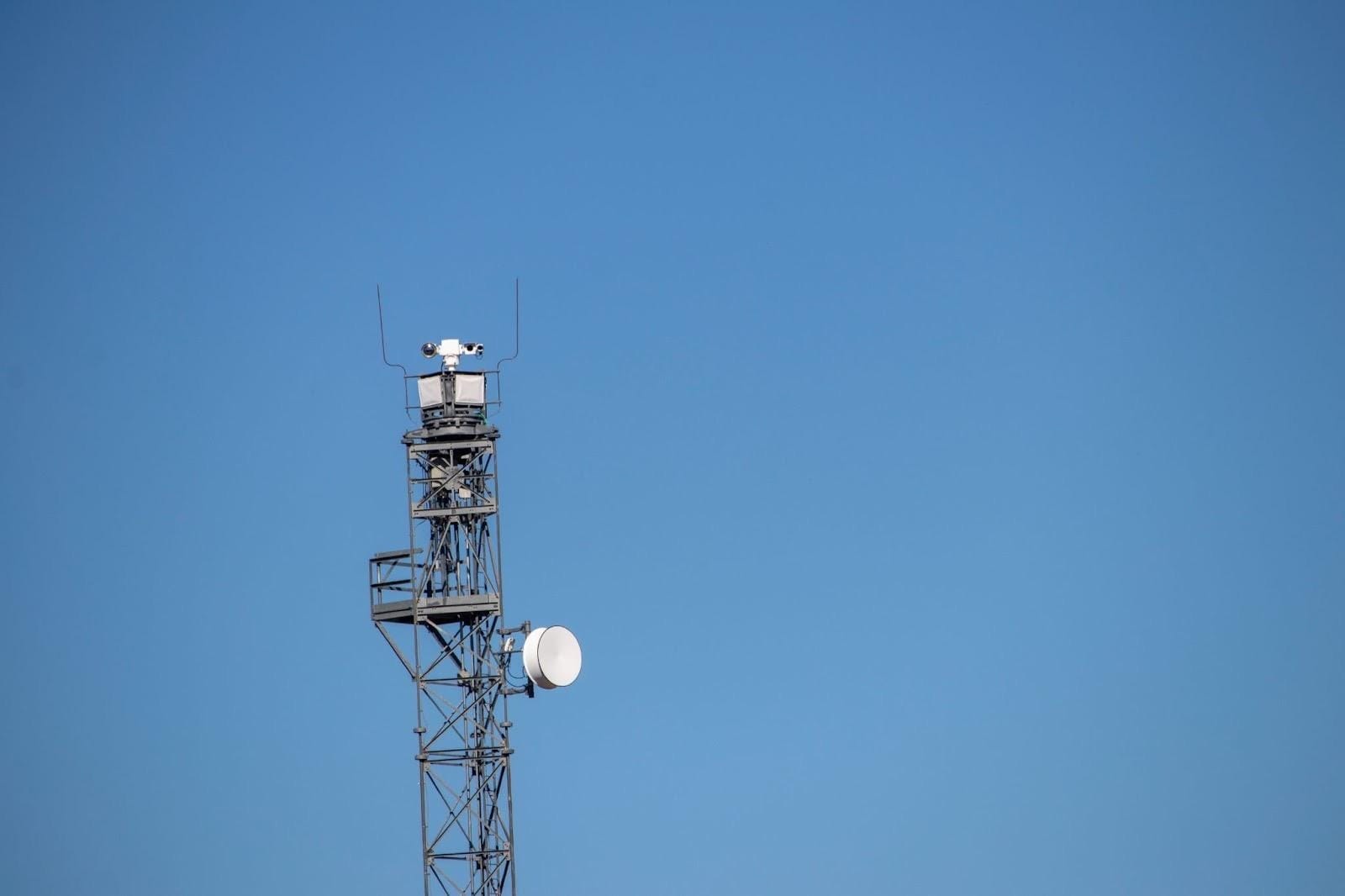 A metal tower with satellite dish
AI-generated content may be incorrect.
